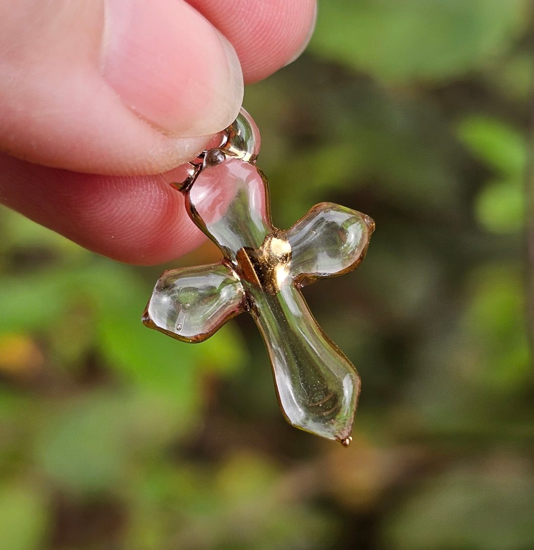 Clear cross pendant with gold heart